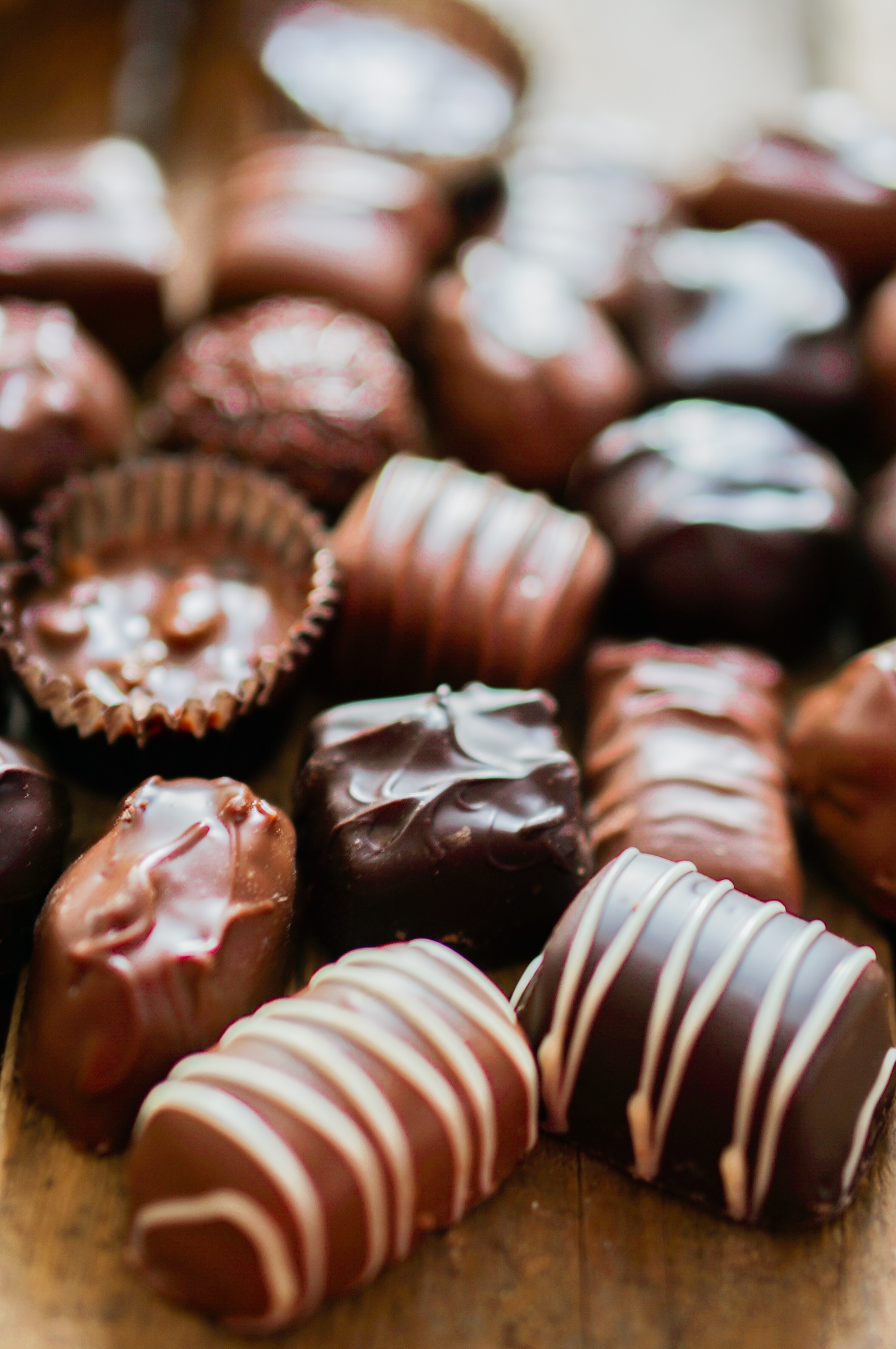 Assorted Chocolate pralines on brown background