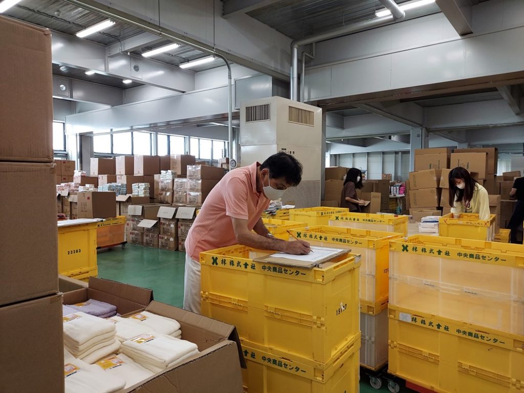president-helping a sending goods to our customer